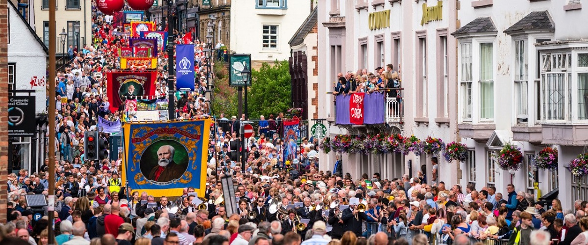 Crowds parade through Durham City as part of Durham Miners' Gala.